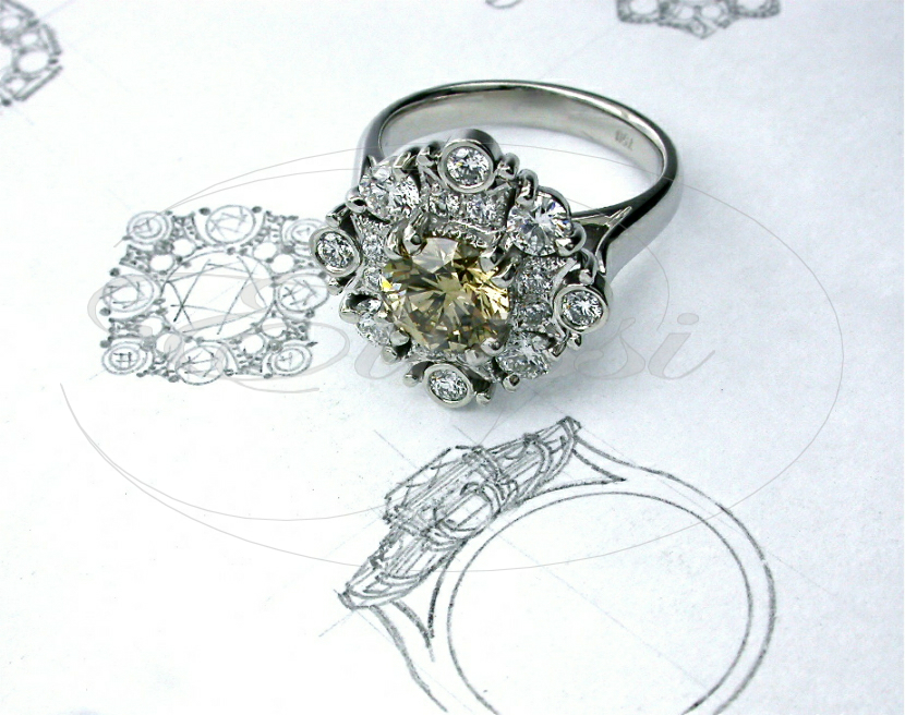 Champagne cluster ring with diamonds set in 18 ct white gold with ellissi ring designing in background