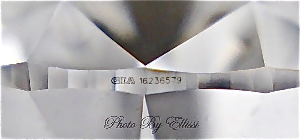FAQ Ellissi Laser Inscription by Gemological Institute of America ( GIA ) on a Round Brilliant Cut diamond girdle ( Faceted edge ), showing the GIA logo and diamond specific reference number. This number coresponds to the diamond certificate and should be identical.