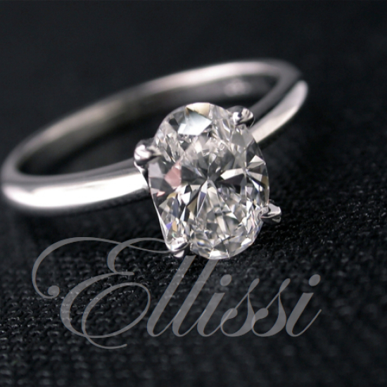 "Felicity" Oval cut four claw solitaire.