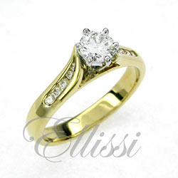 "Nicolette" Yellow gold six claw solitaire.