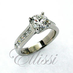 "Finesse" Solitaire with channel set Princess cuts.