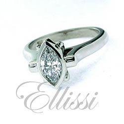 “Marchese” bezel set Marquise diamond ring.