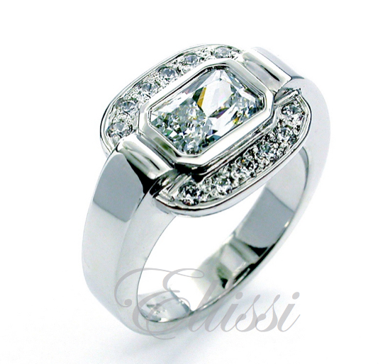 “Bright” unusual Radiant cut diamond halo ring.
