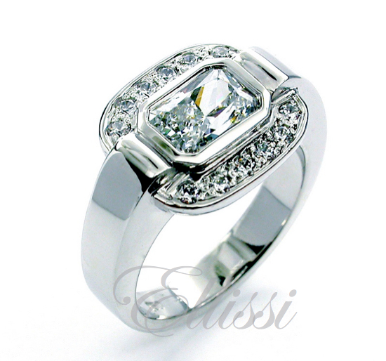 "Bright" unusual Radiant cut diamond halo ring.