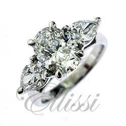 "Ovala" Oval and pear brilliant diamond trilogy ring.