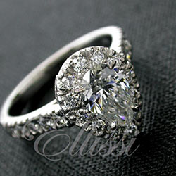"Mirabilis" Pear shaped diamond halo cluster ring.