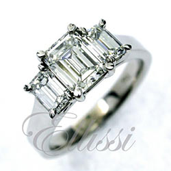 "Balance" Emerald cut diamond trilogy ring.