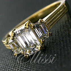 "Flavia" Three stone emerald cut diamond ring.