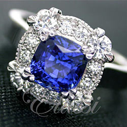 "Davina" cushion sapphire in detailed cluster ring.