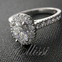 “Dora” Oval cut diamond halo ring.