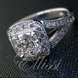 "Euphemia" Cushion cut in a halo of diamonds.