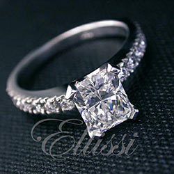 “Gloria” Radiant cut diamond in a diamond set band.