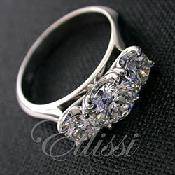 "Gusta" Three stone claw set diamond ring.