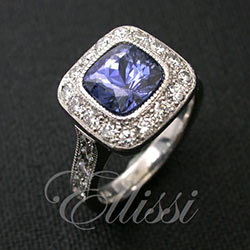 “Viola” Cushion cut Ceylon sapphire in a halo setting.