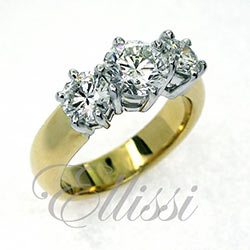 “Charlize” two tone Round brilliant cut trilogy ring.