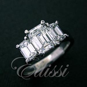 Three-stone Emerald cut diamond trilogy ring.