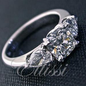 “Tasia” Three stone cushion and pear shape diamond ring.