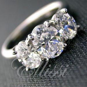 "Sylvia" Three-stone oval cut diamond ring.