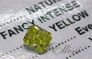 Fancy intense yellow radiant cut diamond photographed on its GIA certificate. Yellow coloured diamonds such as this are quite rare. 