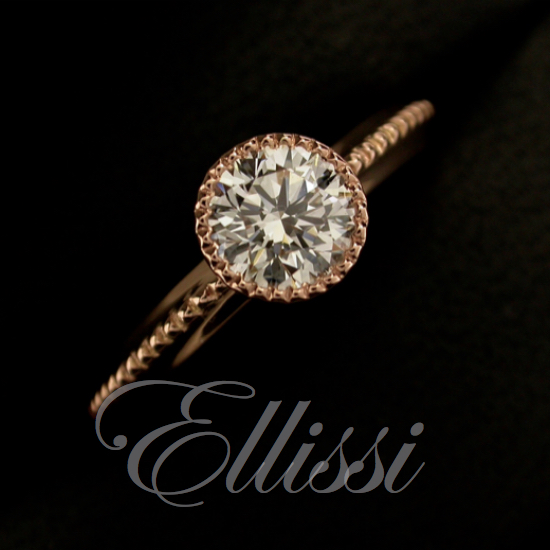 This is a rose gold solitaire set with a round brilliant cut diamond