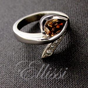 Diamond ring designs like this one featuring a partial bezel setting 