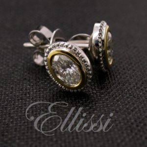 Oval diamond stud earrings in white gold and yellow gold