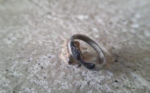 Unusual engagement ring hand carved from a meteorite