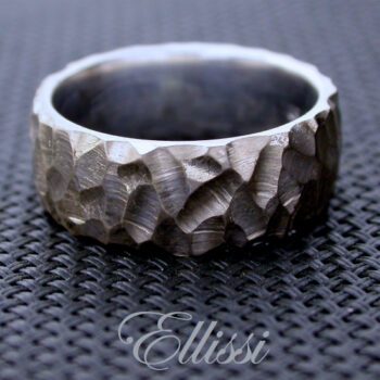 The surface of this male wedding ring has been gouged with a small burr