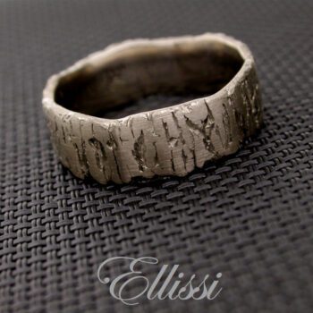 Individual, earthy textured finish on this 18ct. white gold gent's wedding band