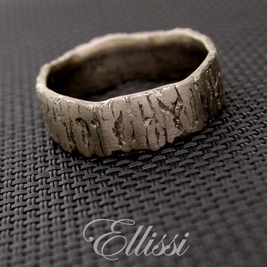 Individual, earthy textured finish on this 18ct. white gold gent's wedding band