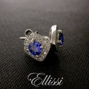 Round sapphire earrings surrounded by a soft square of diamonds