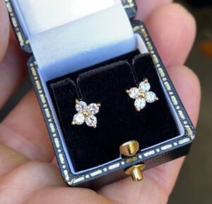 Unique design diamond stud earrings with a total of 0.64ct. of diamonds